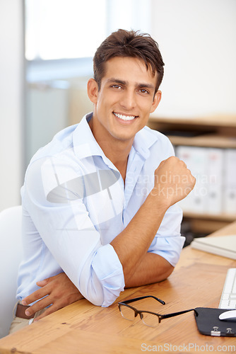 Image of Happy businessman, relax or portrait with confidence at office with pride for career ambition. Smile, manager or male employee with job opportunity at workplace, desk or table for a corporate company