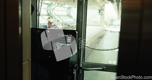 Image of Subway, driver and cockpit of train in transport, service and control panel in Japan railway cab. Metro, travel and man in cabin with uniform, dashboard and arrive at platform on schedule for journey