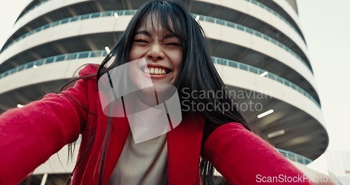 Image of Selfie, woman and outdoor with a smile, buildings and confidence with urban town, memory and social media. Profile picture, Japanese person and girl with happiness, excited and digital app with joy