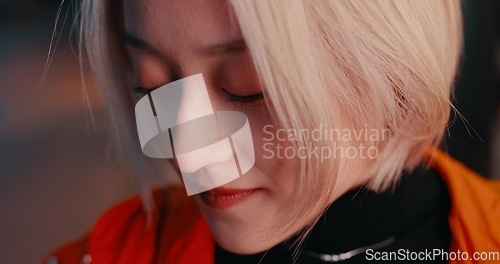 Image of Japanese woman, closeup and city at night with eyes closed on travel, adventure or journey in Kyoto. Gen z, student and face of girl in dark urban street in town with fashion, style or beauty