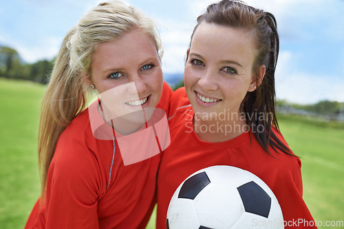 Image of Girls, soccer players and portrait with ball, field and football pitch for match, competition or game. Fitness, practice and ready for training, outdoor and exercise for athlete, happy and sport