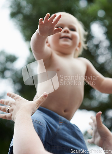 Image of Baby, mother and playing outdoor for development with nurture, relationship and bonding for happiness. Family, child or toddler and hands with early childhood, parenting and love at park in nature