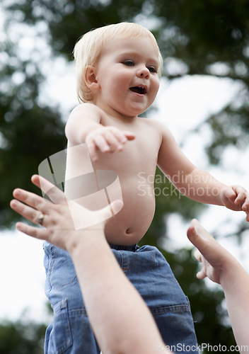 Image of Toddler, mother and playing outdoor for development with nurture, relationship and bonding for happiness. Family, child or baby and hands with early childhood, parenting and love at park in nature