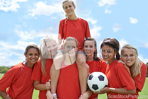 Image of Women, soccer players and portrait with ball, confidence and football field for match, competition or game. Fitness, practice and happy for training, outdoor and exercise for athlete, girls or sport