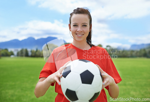 Image of Woman, soccer player and portrait with ball, confident and football field for match, competition or game. Fitness, practice and ready for training, outdoor and exercise for athlete, strong or sport