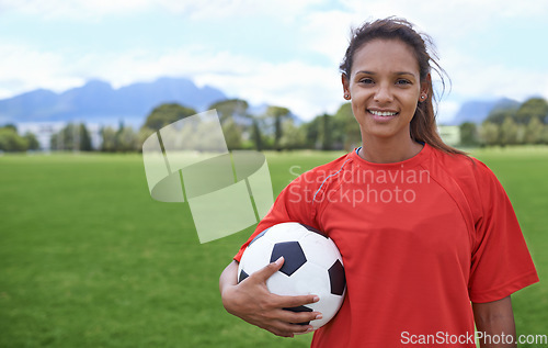 Image of Girl, football field and portrait with ball, happy and soccer player for match, competition and game. Fitness, practice and ready for training, outdoor and exercise for athlete, fun and sport