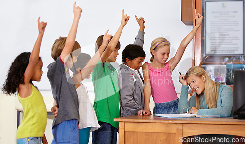 Image of Teacher woman, class and children with raised hand for questions, answer or pop quiz with headache. Teaching person, school kids and education for development, scholarship or assessment at academy