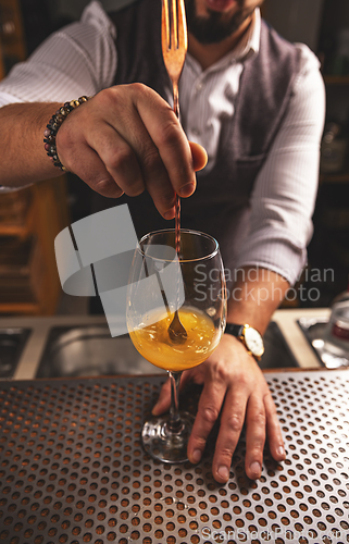 Image of Man bartender works