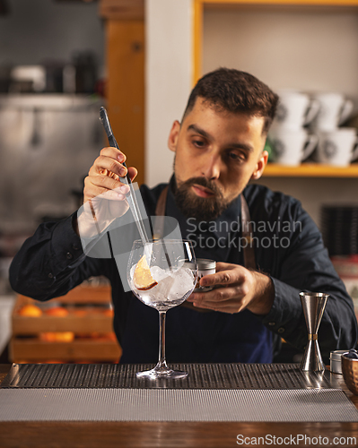 Image of Professional bartender prepare a fresh cocktail