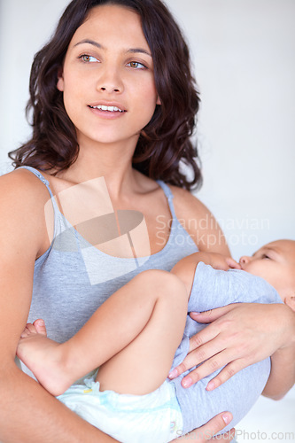 Image of Mom holding baby in home for sleep, bonding and child care with support in morning. Happy woman, toddler boy and bedtime together in apartment with development, fatigue and safety with mothers love.