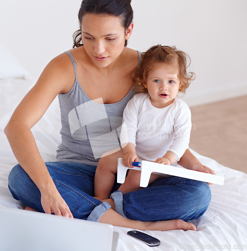 Image of Portrait, baby and mom on laptop in bedroom for remote work, learning or online education in home. Freelancer mother, computer and kid on bed playing with abacus, care or toddler together with family