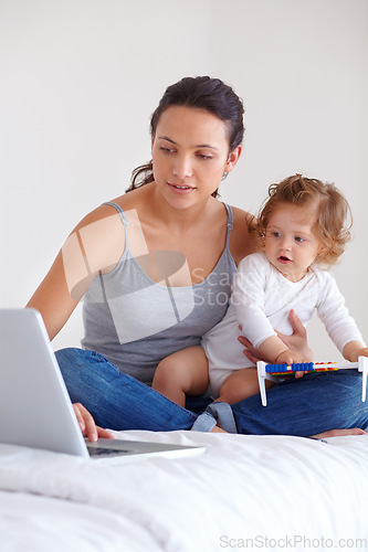 Image of Laptop, baby and mom in bedroom for remote work, mom learning or online education in home. Freelancer parent, computer and kid on bed playing with abacus, child care and toddler together with family