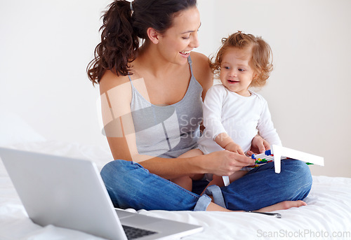 Image of Learning, baby and happy mother on laptop in bedroom for online education or remote work at home. Freelancer mom, computer and kid in bed playing with abacus, care and toddler together with family