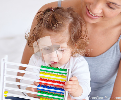 Image of Abacus, math and toddler with mother playing, learning and teaching for child development on bed. Bonding, toy and closeup of mom teaching kid, infant or baby with counting in bedroom at home.