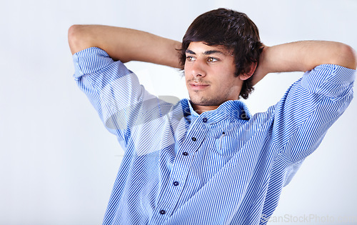Image of Happy man, relax and sitting back at office on break for done, completion or finished on a white studio background. Face of young handsome male person or employee in rest with blue t shirt on mockup