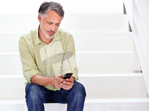 Image of Business, man or phone on stairs in office for social network, download digital app or contact in agency. Mature entrepreneur typing on smartphone, reading mobile notification or search news on steps