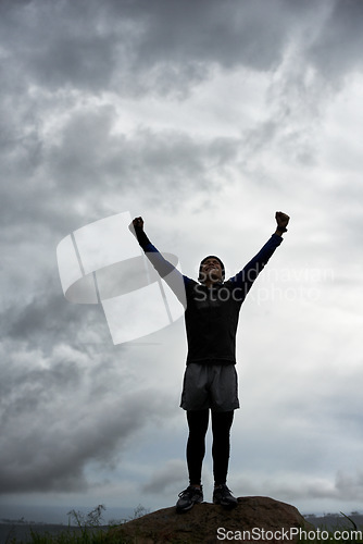 Image of Happy man, mountain peak or hands up for celebration in training, exercise or workout success. Excited athlete, sky or healthy hiker with cheering, gratitude or freedom in nature for fitness