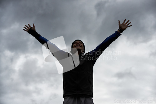 Image of Happy man, sky or hands up for fitness celebration in training, exercise or workout success. Excited, proud athlete or healthy hiker with silhouette, gratitude or freedom to explore nature outdoors