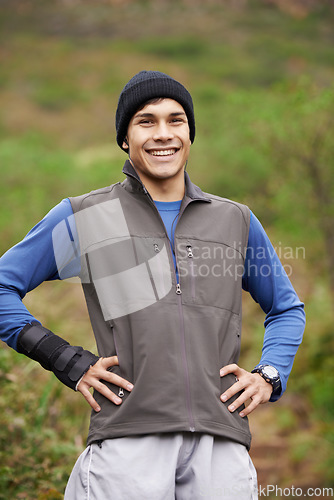 Image of Portrait, runner or happy man in forest ready for a workout, exercise or fitness training in park, woods or nature. Pride, confident sports person or healthy athlete with smile, wellness or energy