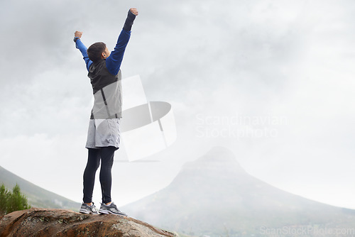Image of Man, hiking and celebrate on mountain peak and back with progress, exercise and workout. Hiker, fitness and climber for training, victory and success to explore, hobby and health in outdoors