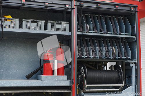 Image of Close-up of essential firefighting equipment on a modern firetruck, showcasing tools and gear ready for emergency response to hazardous fire situations