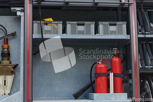 Image of Close-up of essential firefighting equipment on a modern firetruck, showcasing tools and gear ready for emergency response to hazardous fire situations