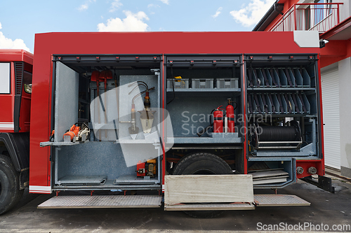 Image of Close-up of essential firefighting equipment on a modern firetruck, showcasing tools and gear ready for emergency response to hazardous fire situations