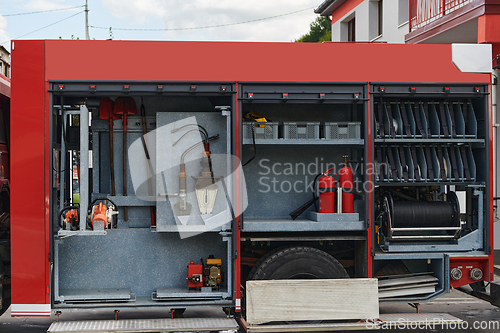 Image of Close-up of essential firefighting equipment on a modern firetruck, showcasing tools and gear ready for emergency response to hazardous fire situations