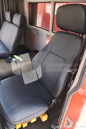 Image of The close-up capture reveals the intricate details of the ergonomic seats and high-tech interior of a modern firefighting truck, showcasing a perfect blend of functionality and safety features