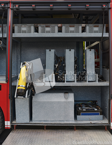 Image of Close-up of essential firefighting equipment on a modern firetruck, showcasing tools and gear ready for emergency response to hazardous fire situations