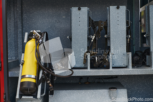 Image of Close-up of essential firefighting equipment on a modern firetruck, showcasing tools and gear ready for emergency response to hazardous fire situations