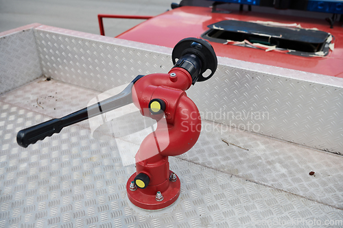 Image of Close-up of essential firefighting equipment on a modern firetruck, showcasing tools and gear ready for emergency response to hazardous fire situations