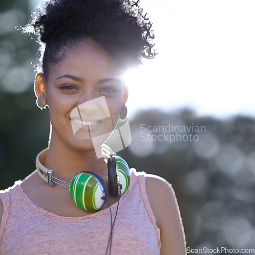 Image of Portrait, student or happy woman at park with headphones at university campus outdoor in nature. Face, college and smile of girl or young person in education for learning to study at school in Brazil