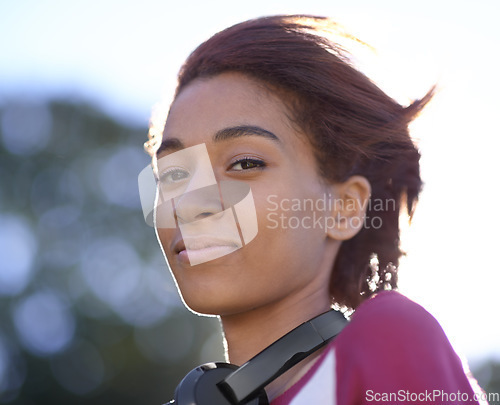 Image of Portrait, student and woman at park with headphones at university campus outdoor in nature. Face, music and beauty of young girl or person with tech for listening to audio, song or sound in Brazil