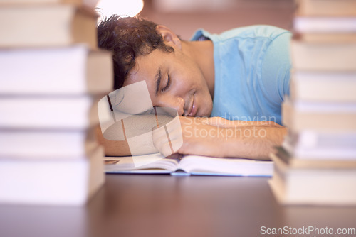 Image of University books, education and tired man sleeping during academy study, research or knowledge learning. College, textbook and Indian student with fatigue, nap and exhausted after reading literature