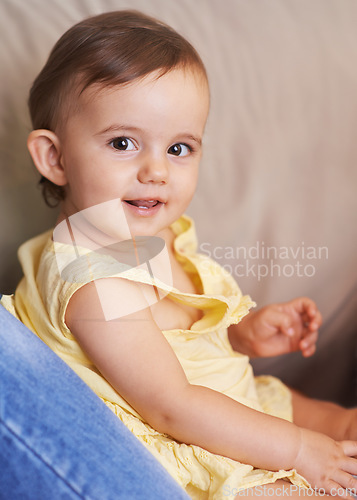 Image of Baby, portrait and sitting on couch, child development and infant growth with face, happy and home. Girl, joyful and healthy in good mood, childhood and cheerful with enthusiasm, kid and adorable