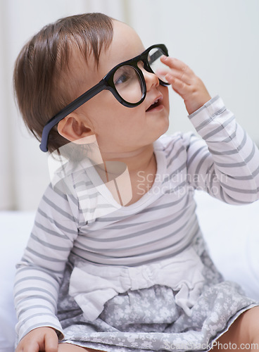 Image of Eye care, vision and young baby with glasses for eyesight, prescription lens frame or ocular support. Face accessory, pediatric ophthalmology and relax youth girl, infant or toddler with eyeglasses