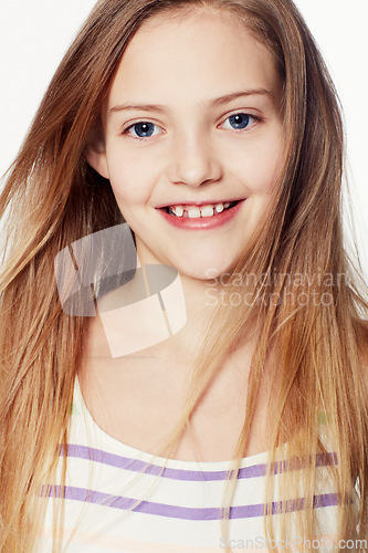 Image of Child, portrait and smile in studio or white background for good mood, youth or mockup space. Female person, model and happiness as young girl for innocent positivity or relax, holiday or carefree