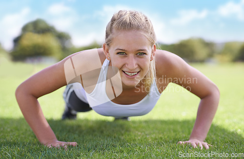 Image of Women, portrait and push ups on grass for exercise with fitness, training and workout on sports field. Athlete, person and confidence on ground with physical activity for healthy body and wellness