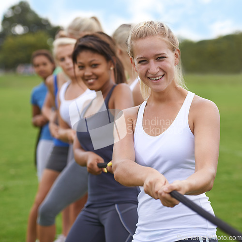 Image of Tug of war, women in park with rope for fitness and game, team building exercise and competition. Trust, support and strong group, training or workout, contest and challenge with power outdoor