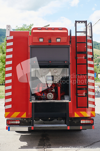 Image of Close-up of essential firefighting equipment on a modern firetruck, showcasing tools and gear ready for emergency response to hazardous fire situations