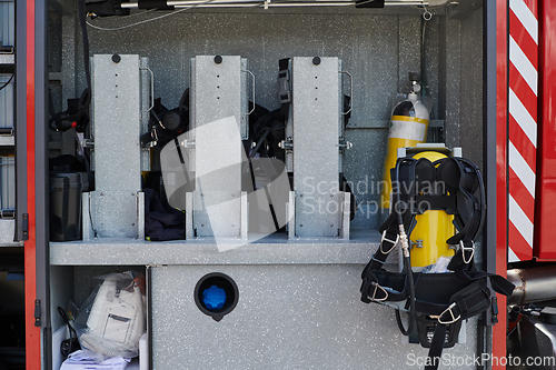 Image of Close-up of essential firefighting equipment on a modern firetruck, showcasing tools and gear ready for emergency response to hazardous fire situations