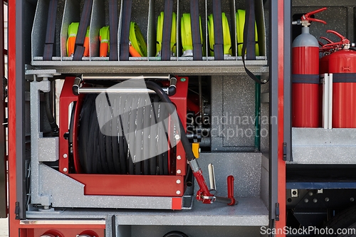 Image of Close-up of essential firefighting equipment on a modern firetruck, showcasing tools and gear ready for emergency response to hazardous fire situations
