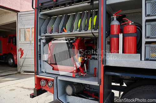 Image of Close-up of essential firefighting equipment on a modern firetruck, showcasing tools and gear ready for emergency response to hazardous fire situations