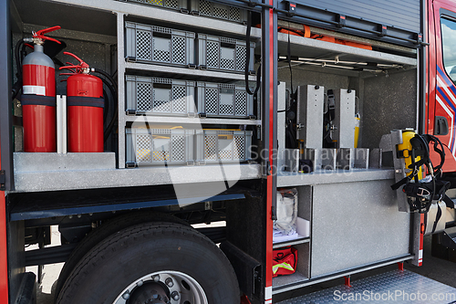 Image of Close-up of essential firefighting equipment on a modern firetruck, showcasing tools and gear ready for emergency response to hazardous fire situations