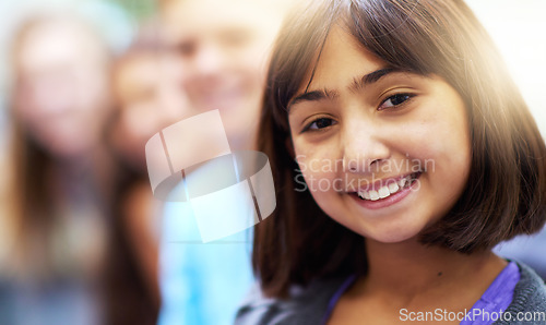 Image of Girl, portrait and smile in corridor at school with confidence and pride for learning, education or knowledge. Student, person or face and happy in building or hallway before class and ready to study