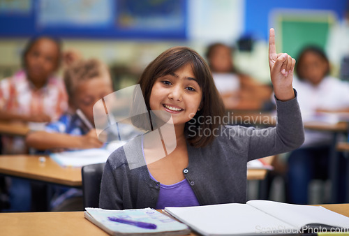 Image of Students, portrait and raise hand in class, elementary school and ask teacher question. Workbook, study and childhood development for education, knowledge and academic information for people