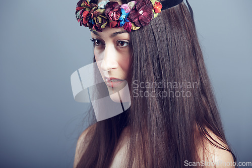 Image of Woman, flower headband in hair and beauty, skin glow and wellness isolated on grey background. Keratin treatment, hairstyle with floral head gear or accessory, dermatology and cosmetics in studio