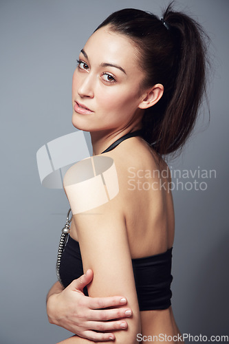 Image of Portrait, confidence and body of woman in underwear in studio isolated on a gray background. Serious model, natural slim figure and natural beauty, health and wellness of person in Brazil for fashion