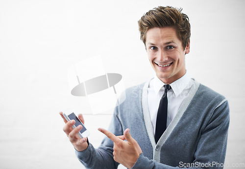 Image of Business man, show phone and studio portrait with mockup space, pointing or happy by white background. Person, entrepreneur and tech startup employee in presentation, choice and smartphone with pride